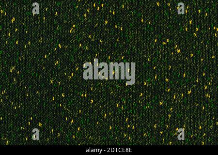 black melange manually knitted fabric with green and yellow blotches - seamless texture and flat background Stock Photo