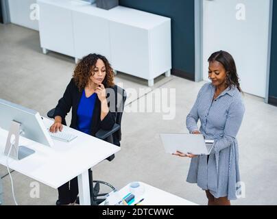 Two women working in office Stock Photo