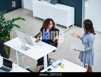 Two women working in office Stock Photo