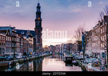 Amsterdam canals in the evening light, Dutch canals in Amsterdam Holland Netherlands during winter time in the Netherlands. Europe Stock Photo