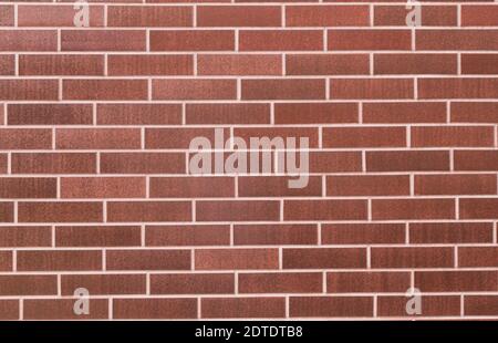 Decorative wall texture of brown stone. Glossy clay stone wall background. Shiny brown stone wall Stock Photo