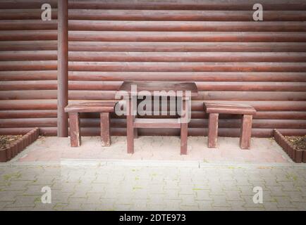 Table and two wooden stools Stock Photo