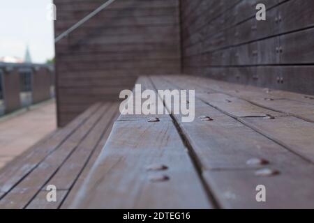 Bench and long boards with bolts. Horizontal plank decking Stock Photo