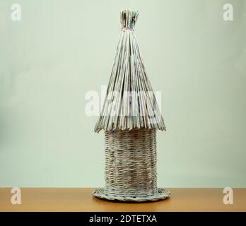 Handmade crafts from old newspapers side view. Bottle stand Stock Photo