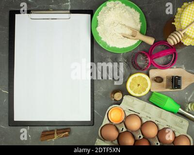 Notebook on a table with baking products Stock Photo