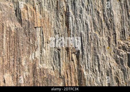 Natural texture of granite rocks and stones. Relief texture of granite stones and slabs Stock Photo