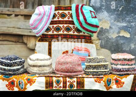 Knitted hats for sale in a traditional fair Stock Photo