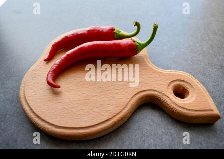 Peppers on a cutting board Stock Photo