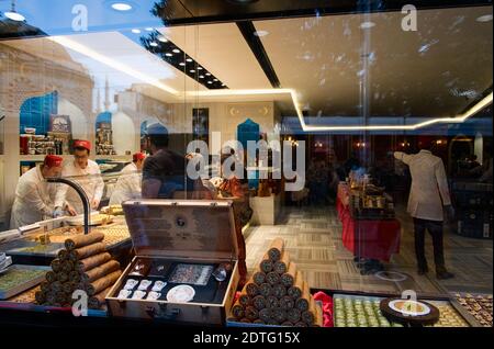 Istanbul, Turkey - September, 2018: People choosing Turkish desert Baklava eastern sweets shop and cafe in a window in Istanbul Stock Photo