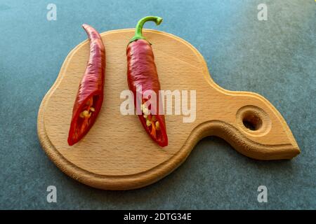 Sliced hot peppers on a cutting board Stock Photo