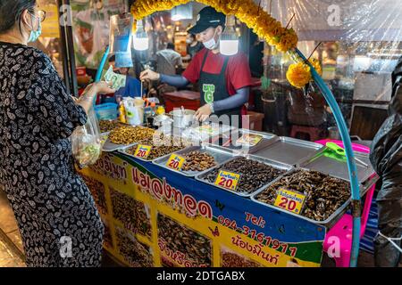 Phuket, Thailand - 17 December 2020 - Fried edible insects for sale at Chillva Market, a walking street in Phuket, Thailand on December 17, 2020 Stock Photo