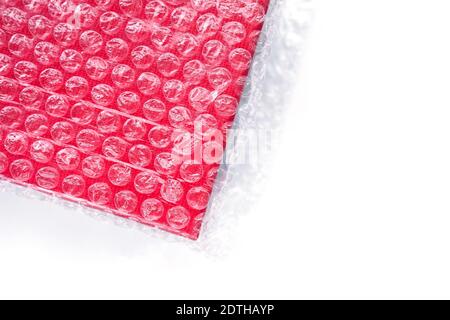 The red box is wrapped in a transparent bag with vacuum bubbles. Stock Photo