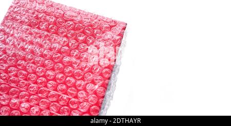 The red box is wrapped in a transparent bag with vacuum bubbles. Banner. Stock Photo