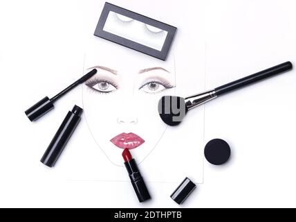 Face chart and different makeup objects and cosmetics on white background Stock Photo