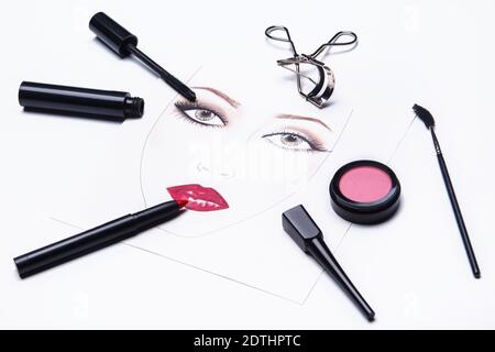 Face chart and different makeup objects and cosmetics on white background Stock Photo