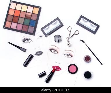 Face charts and different makeup objects and cosmetics on white background Stock Photo