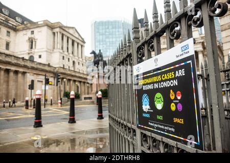 London- December 21, 2020:  Covid19 signage in the city of London by the Bank of England a few days before Christmas after the Tier 4 lockdown Stock Photo
