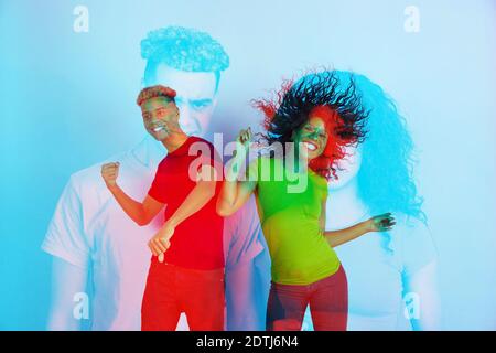 Love. Multiple portrait with glitch duotone effect. Multiple exposure, abstract fashionable beauty photo. Young beautiful african couple posing. Youth culture, composite image, fashionable people. Stock Photo