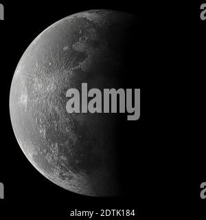 Third quarter moon in the night sky showing crater detail Stock Photo