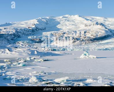 Glacier Fjallsjoekull and frozen glacial lake Fjallsarlon in Vatnajokull NP during winter. Europe, Northern Europe, Iceland, February Stock Photo