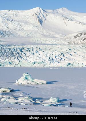 Glacier Fjallsjoekull and frozen glacial lake Fjallsarlon in Vatnajokull NP during winter. Europe, Northern Europe, Iceland, February Stock Photo