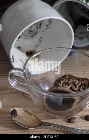 A dirty coffee Cup and saucer and a coffee mug. Stock Photo
