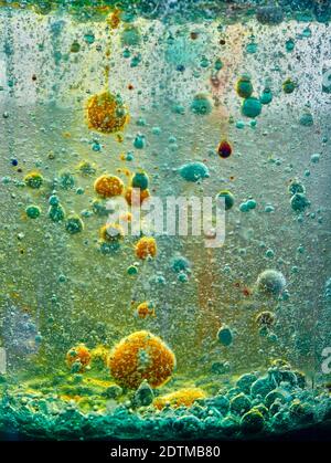 Brightly coloured abstract with bubbles caused by a chemical reaction Stock Photo