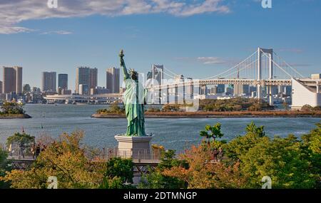 Japan, Tokyo City, Minato Ku, Odaiba, Statue of Liberty and Rainbow Bridge Stock Photo
