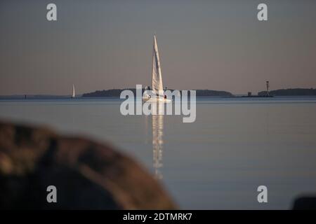 Yacht between the archipelago near Turku, Finland in sunset Stock Photo