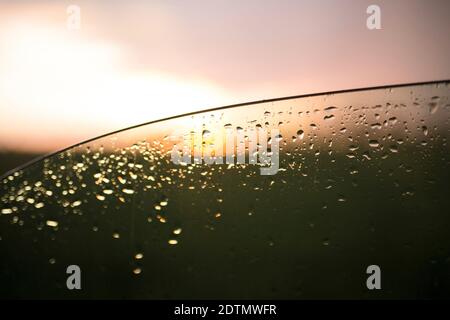 View through a lowered car window onto the landscape after a thunderstorm Stock Photo