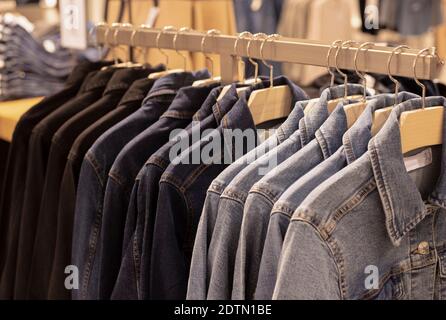 Row of jackets on hangers, clothing store, fabric Stock Photo by NomadSoul1
