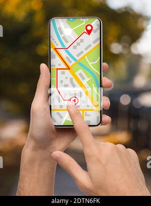 Man Planning Route To Destination Point, Using Gps App On Smartphone Stock Photo