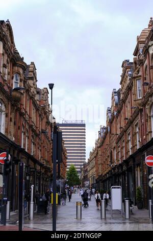 LEEDS, UNITED KINGDOM - Jul 15, 2020: Leeds city centre high street quiet on a cloudy day with the golden pinnacle offices in the back ground Stock Photo