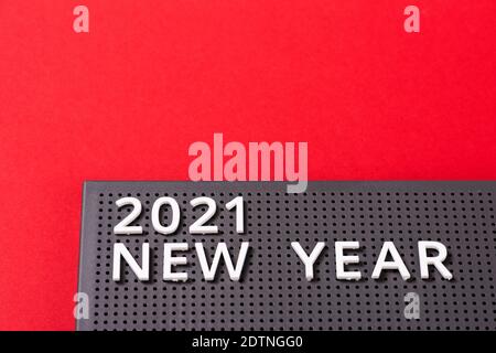 2021 New year on gray letter board. Goal, plan, action text on red paper ultimate background Stock Photo