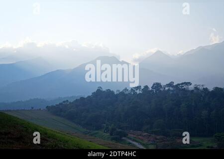 Surrounding hills and embankment of the banasura sagar dam in wayanad, Kerala, India. It is the largest earth dam in India and second largest in asia. Stock Photo