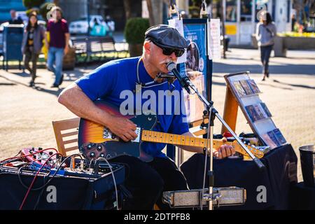 Dave Earl, a street Blues musician, performing at the entrance plaza of Pier 39. Stock Photo