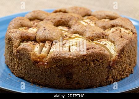 Freshly baked apple pie on a blue plate. Stock Photo