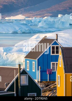 View of fjord full of icebergs towards Nuussuaq (Nugssuaq) peninsula during midnight sun. The town Uummannaq in the north of West Greenland, located o Stock Photo