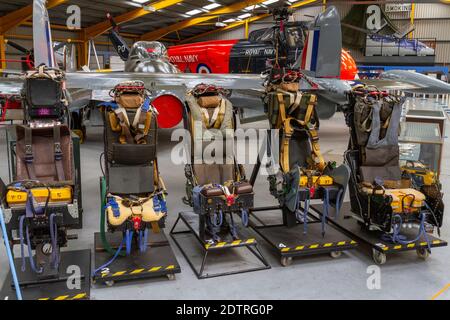 Generational line up of five Martin-Baker ejection seats used on RAF aircraft, Newark Air Museum, near Newark-on-Trent, Nottinghamshire, UK. Stock Photo