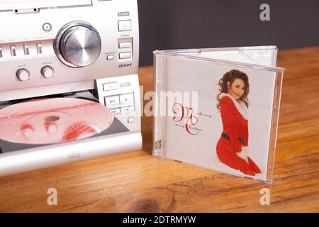 Mariah Carey Merry Christmas album, CD album cover in focus, Music CD in HiFi system ready to play Stock Photo