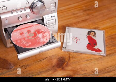 Mariah Carey Merry Christmas album cover, disc in focus, Music CD in HiFi system ready to play Stock Photo
