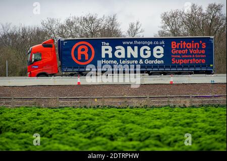 Dorney, UK. 22nd December, 2020. An HGV transports goods for The Range today on the M4. Following the new Covid-19 variant in the South East of England, France have closed their channel ports to UK freight. Despite, this it was business as usual today as there were plenty of freight shipments still being transported on the M4. The action by Emmanuel Macron the President of France may lead to some temporary shortages of imported citrus fruit and vegetables from the EU, however, the French action appears to only be strengthening the campaign to buy British. Credit: Maureen McLean/Alamy Live News Stock Photo