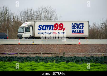 Dorney, UK. 22nd December, 2020. A Sam99p HGV on the M4 today. Following the new Covid-19 variant in the South East of England, France have closed their channel ports to UK freight. Despite, this it was business as usual today as there were plenty of freight shipments still being transported on the M4. The action by Emmanuel Macron the President of France may lead to some temporary shortages of imported citrus fruit and vegetables from the EU, however, the French action appears to only be strengthening the campaign to buy British. Credit: Maureen McLean/Alamy Live News Stock Photo