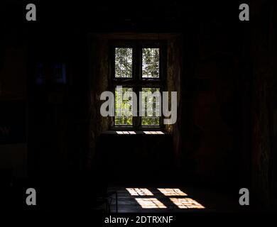 Vintage window and dark shadows in the old building Stock Photo