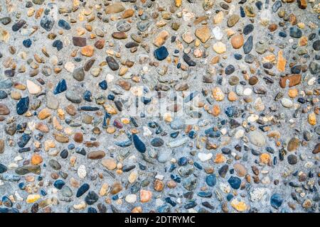 Small pebble and cement floor background Stock Photo