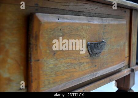 Table drawer, vintage, drawer handle detail, with selective focus on natural wood, photo zoom, Brazil, South America Stock Photo