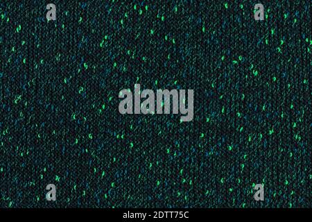 black melange manually knitted fabric with emerald green and blue blotches - seamless texture and flat background Stock Photo