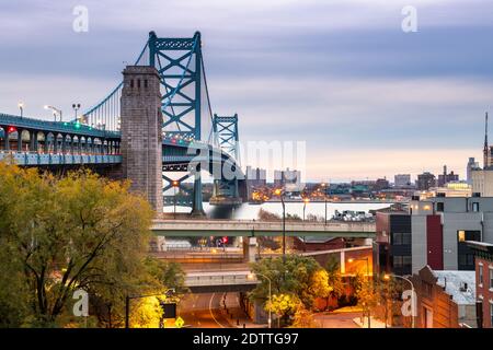 Philadelphia, Pennsylvania, USA at Benjamin Franklin Bridge spanning the Delaware River towards Camden, New Jersey. Stock Photo