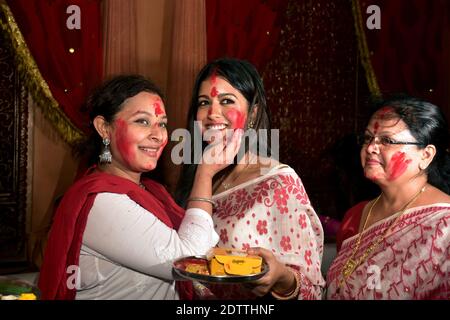 Married bengali women participate the Sindur Khela Utsav during the Vijayadasami celebration in Mumbai, India. Stock Photo