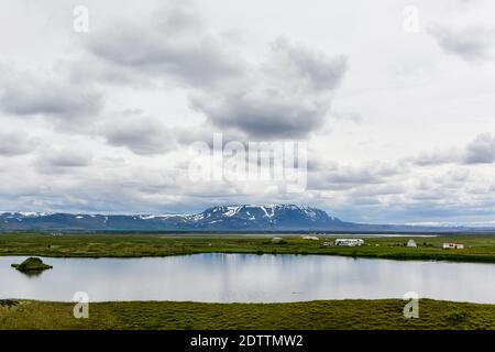 The coastline around the pond Stakholstjorn with pseudo craters - natural monument near Lake Myvatn in Northern Iceland in summer Stock Photo